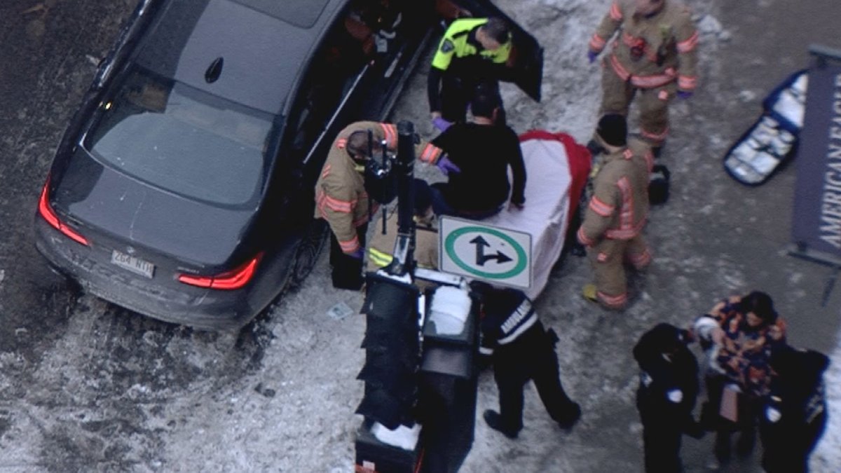A man is being helped onto a stretcher after a stabbing in downtown Montreal. Thursday, Jan. 31, 2019.