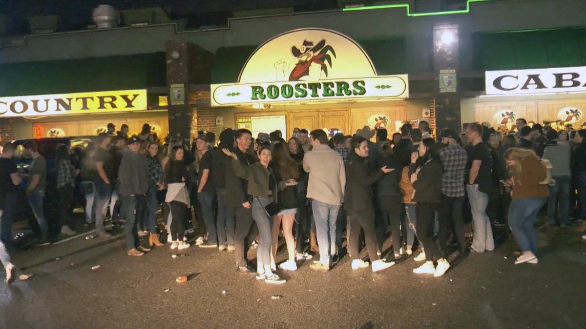 Huge crowds line up outside Pitt Meadows' Roosters Country Cabaret. The iconic bar is closing its doors for good Sunday, after more than two decades in business. 