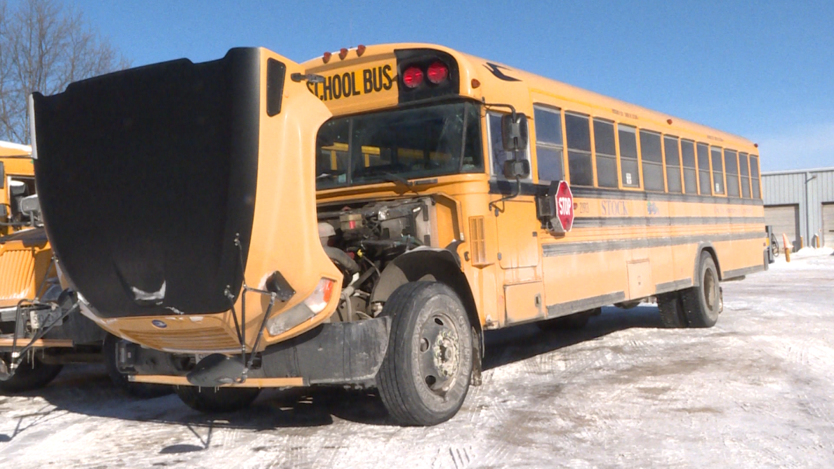 A cold school bus sits in an empty lot.