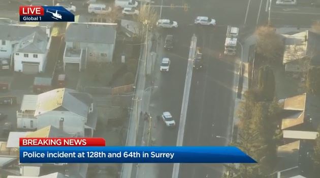 Footage from the Global 1 chopper shows Surrey RCMP on scene outside a home at 128 Street and 64 Avenue.