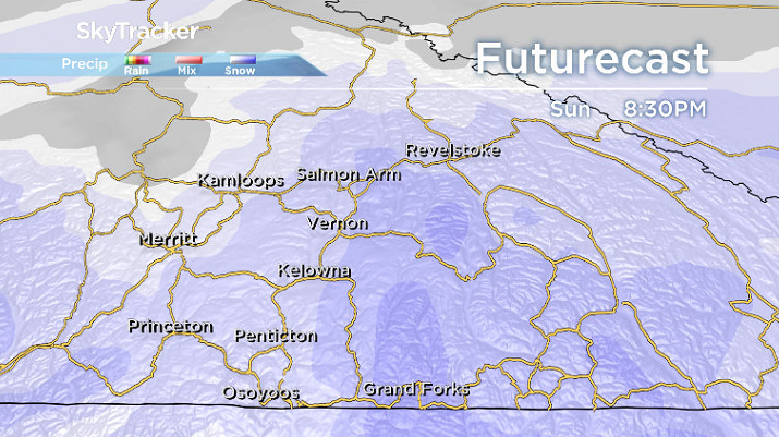 System sliding through with a punch of arctic air slides snow in across the Okanagan on Sunday.