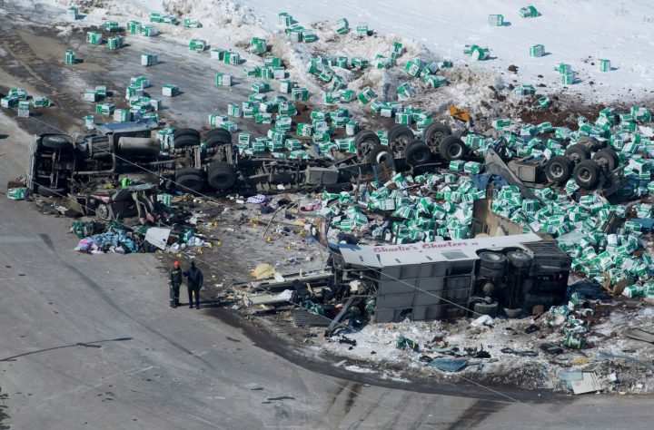 Emergency personnel work at the scene of a fatal crash outside of Tisdale, Saskatchewan, Canada, on April, 7, 2018.