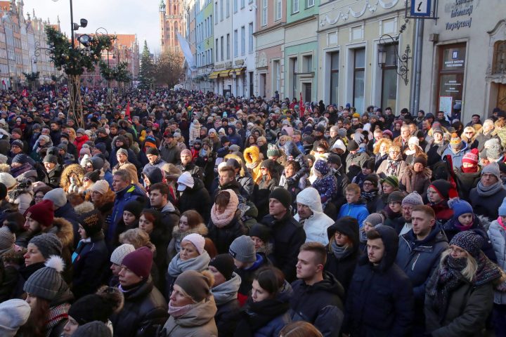 People gather to watch on big screens a funeral service of the late Gdansk Mayor Pawel Adamowicz in Gdansk, Poland, 19 January 2019.