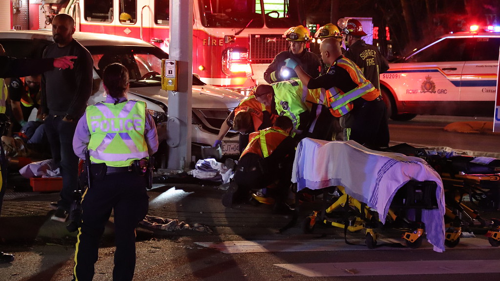 Careening vehicle hits pedestrians waiting to cross street in Surrey - image