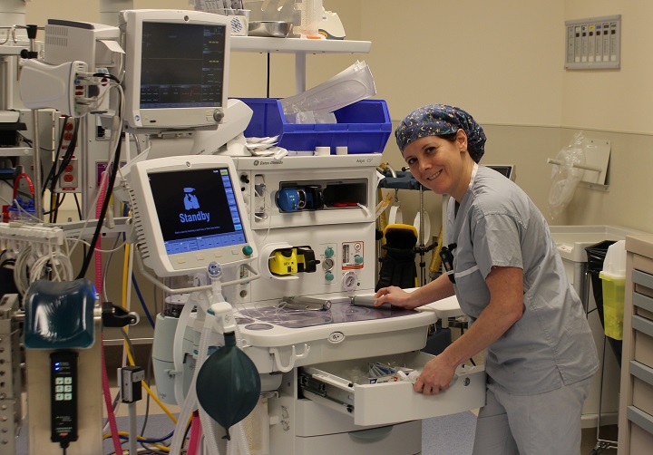 Jodi Manchee, a registered nurse in an operating room, with an anaesthesia machine.