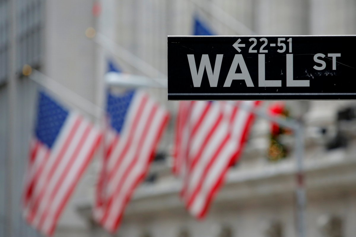 A street sign for Wall Street is seen outside the New York Stock Exchange (NYSE) in Manhattan, New York City, U.S. December 28, 2016.