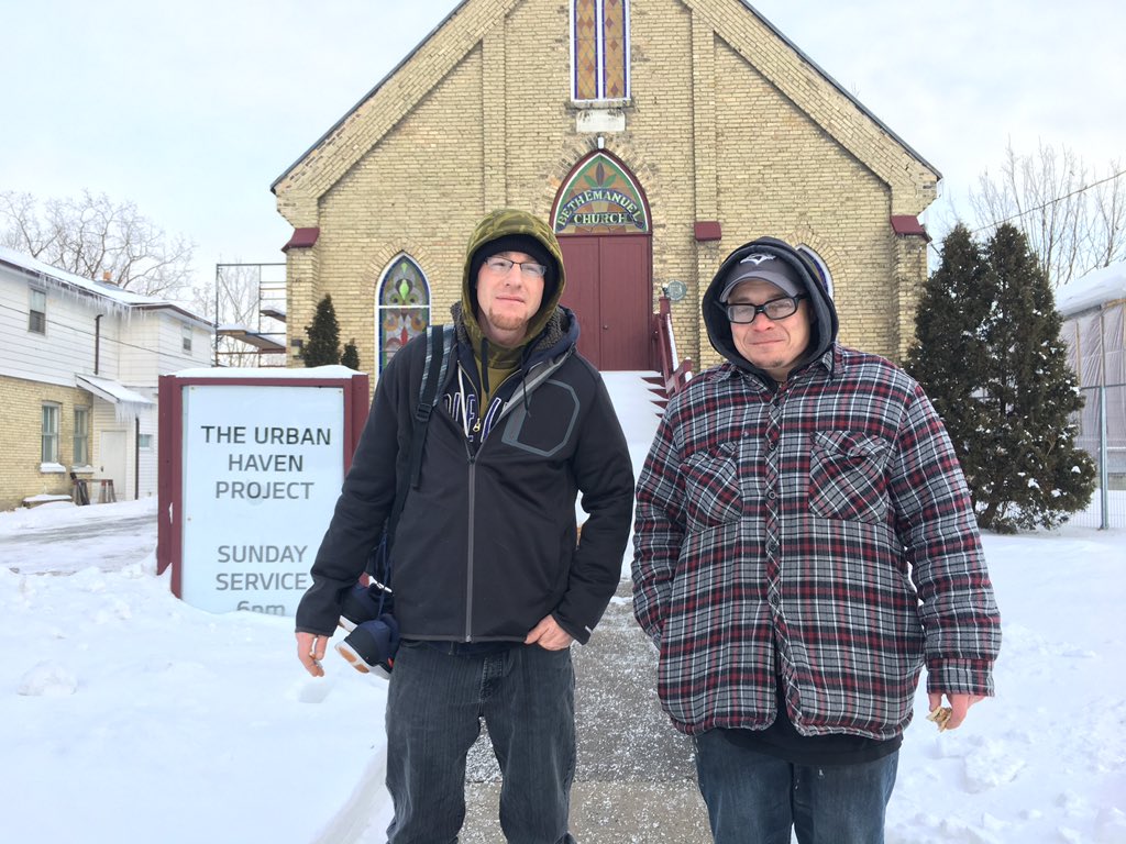Wayne and Kevin leave the Beth Emanuel Church, after spending the night sleeping on the floor of its sanctuary. 
