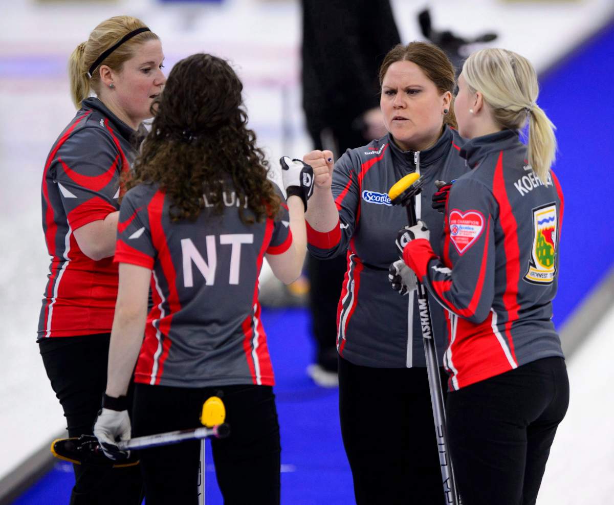 Northwest Territories skip Kerry Galusha (second right) talks with her team as they take on New Brunswick at the Scotties Tournament of Hearts in Penticton, B.C., on Monday, Jan. 29, 2018.