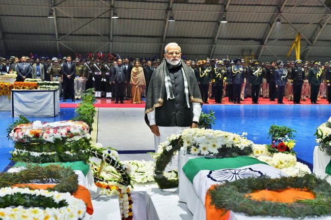 India’s Prime Minister Narendra Modi pays tribute as he stands next to the coffins containing the remains of Central Reserve Police Force (CRPF) personnel in New Delhi, India, Feb. 15, 2019.