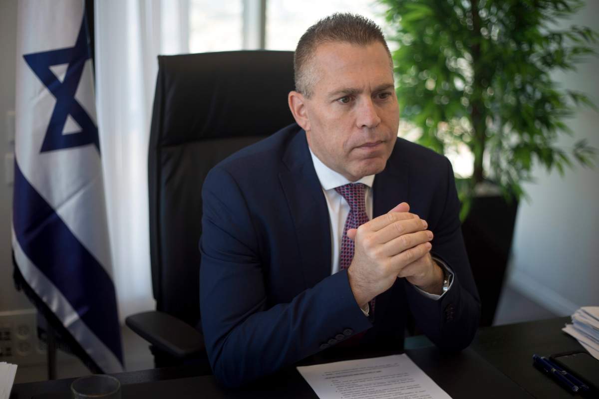 FILE - In this Thursday, Oct. 26, 2017, file photo, Israeli Public Security Minister Gilad Erdan speaks during an interview with The Associated Press at his office in the Tel Aviv suburb of Bnei Brak.