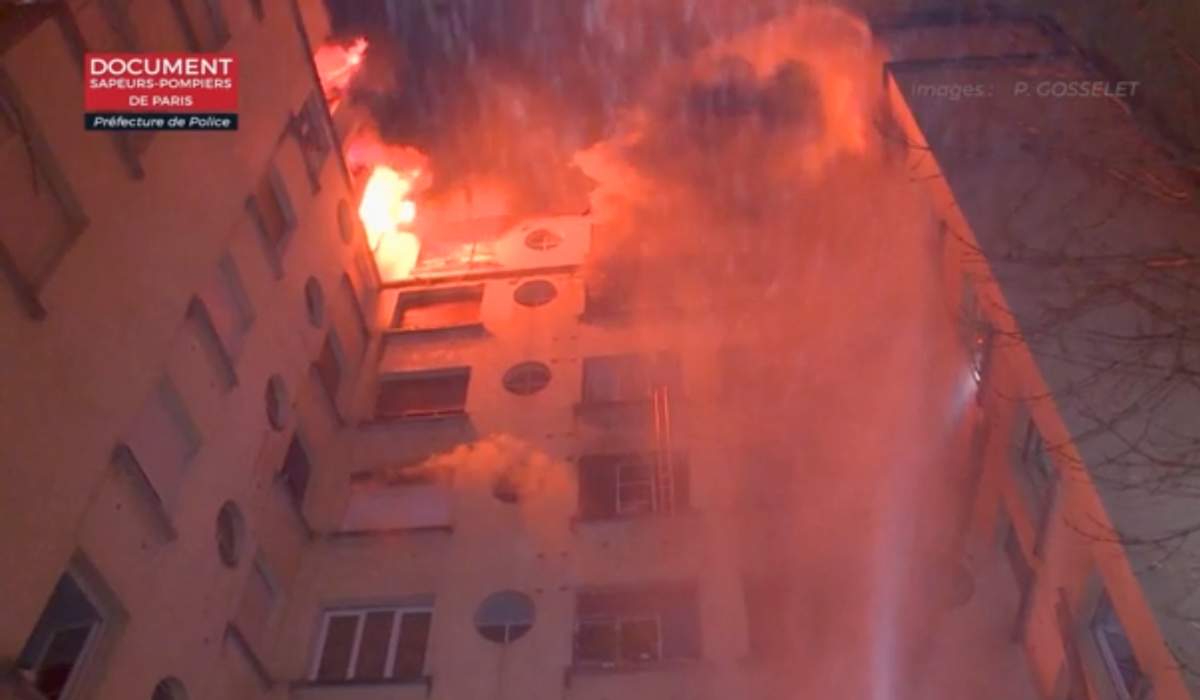 In this image taken from video released by the Paris Fire Dept., fire fills the top floors of an apartment building, Tuesday, Feb. 5, 2019, in Paris, France.