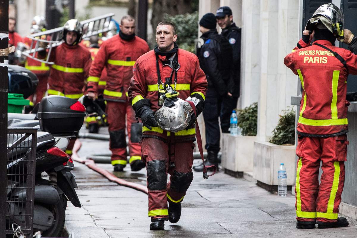 Parisians firefighters in action after a fire broke out at an apartment in the 16th district of western Paris, France, 05 February 2019.