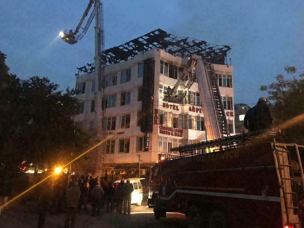 S hotel guest who was rescued, firefighters rescue people during an early morning fire at the Arpit Palace Hotel in the Karol Bagh neighborhood of New Delhi.
