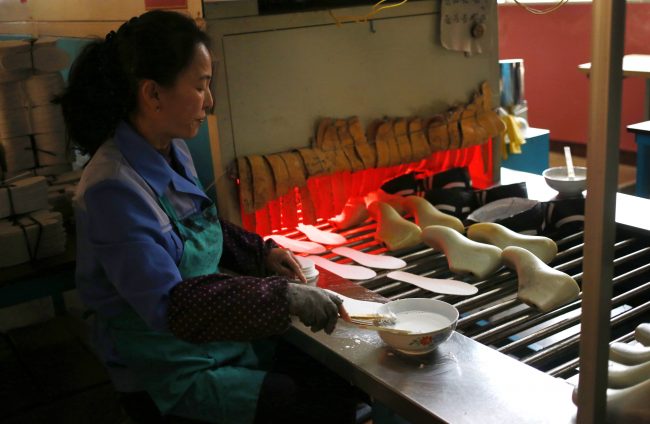 A worker tends to her station at the Ryuwon Shoe Factory in Pyongyang, North Korea, Feb. 1, 2019.