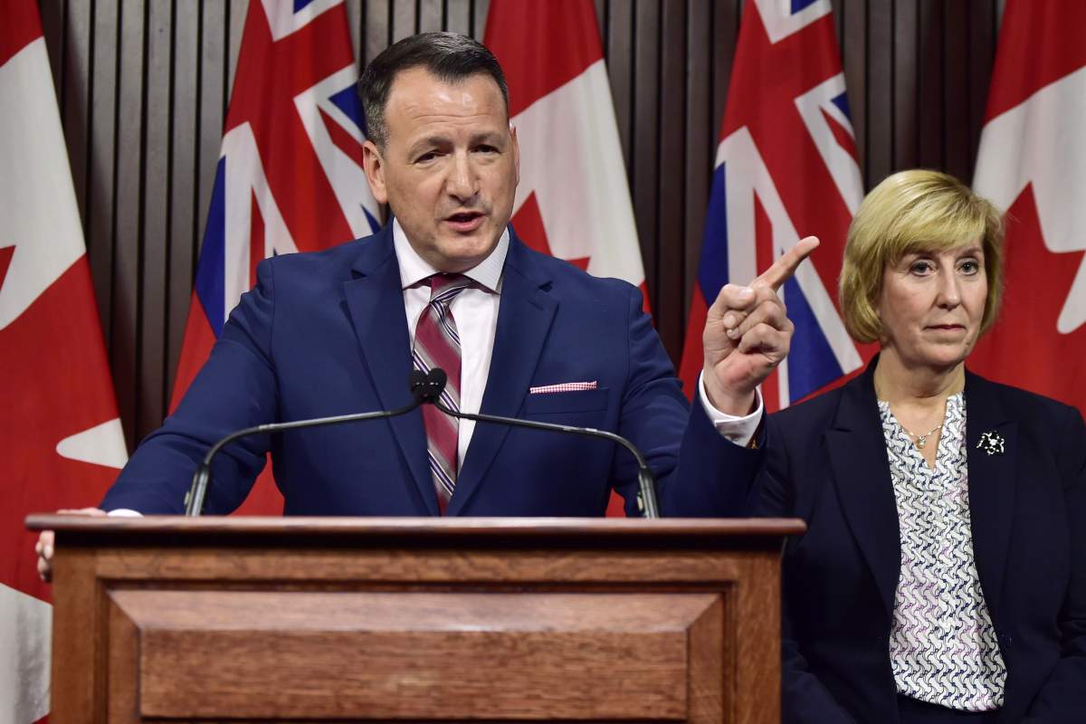 Spokesperson to the report says Energy Minister Greg Rickford, seen on the left, is considering the panel's recommendations.