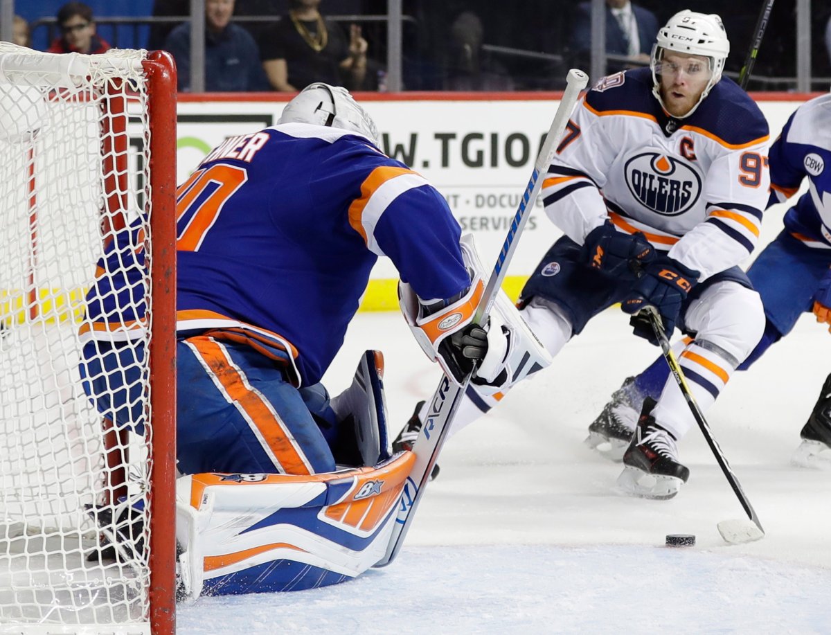 Edmonton Oilers' Connor McDavid (97) attempts to score on New York Islanders goaltender Robin Lehner during the first period of an NHL hockey game Saturday, Feb. 16, 2019, in New York. (AP Photo/Frank Franklin II).