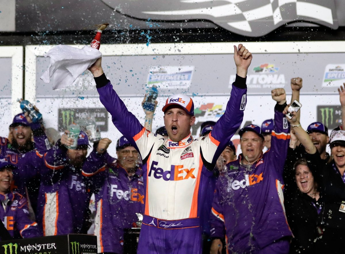 Denny Hamlin celebrates in Victory Lane after winning the NASCAR Daytona 500 auto race at Daytona International Speedway, Sunday, Feb. 17, 2019, in Daytona Beach, Fla. (AP Photo/John Raoux).