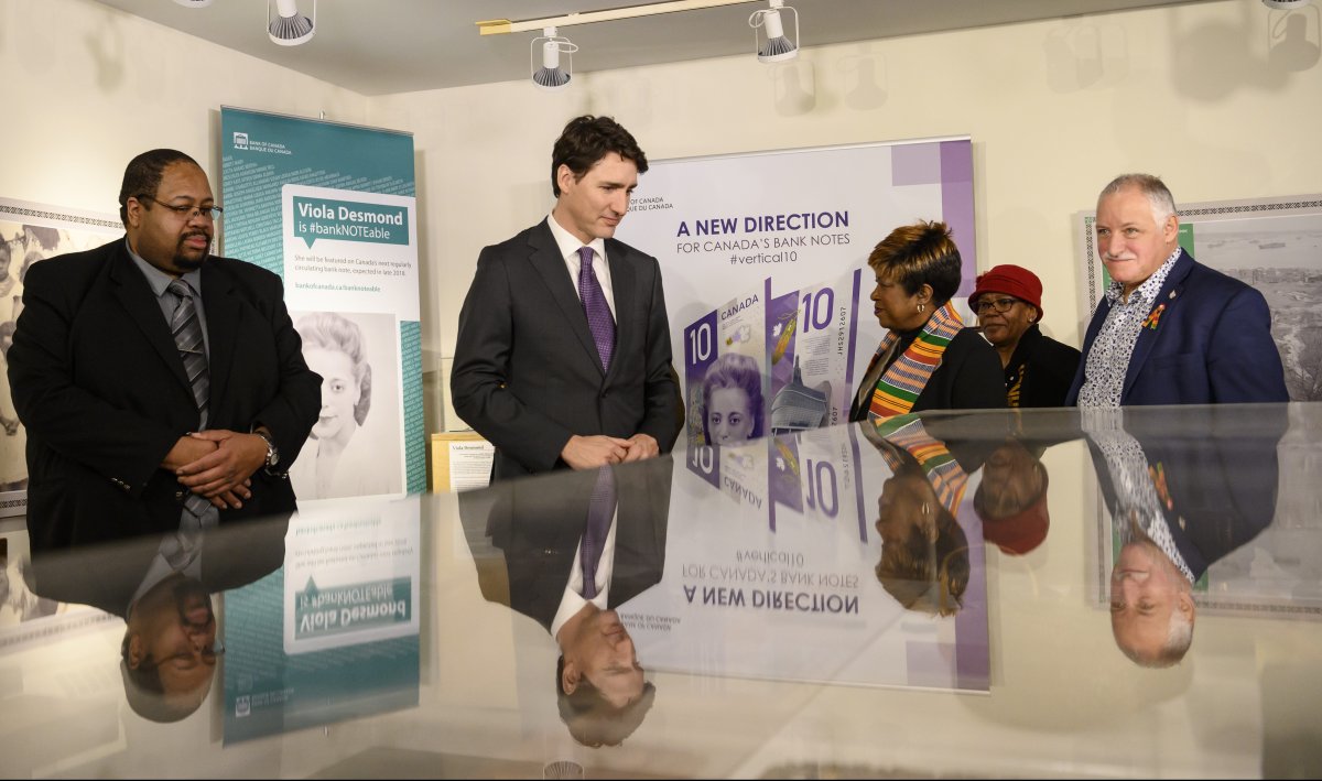 Prime Minister Justin Trudeau, second from left, and MP Darrell Samson tour the Black Cultural Centre for Nova Scotia with community leaders in Halifax on Thursday, Feb. 21, 2019. 