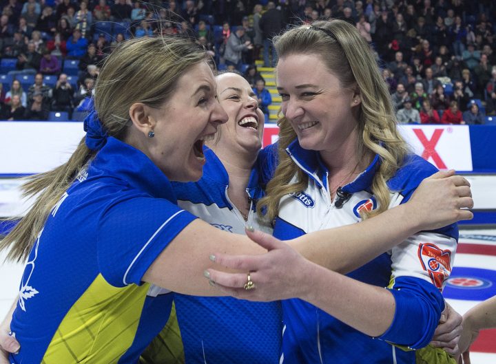 Alberta lead Rachel Brown, second Dana Ferguson and skip Chelsea Carey react after defeating Ontario 8-6 to win the Scotties Tournament of Hearts at Centre 200 in Sydney, N.S., on Sunday, Feb. 24, 2019. 