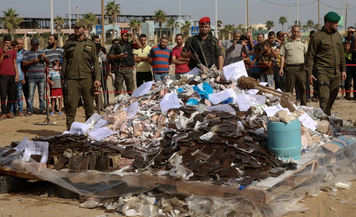 Hamas security forces prepare to burn some 1,383 bars of hashish and 1,242,000 pills of Tramadol, that have been seized since the beginning of 2018, in Gaza City. 