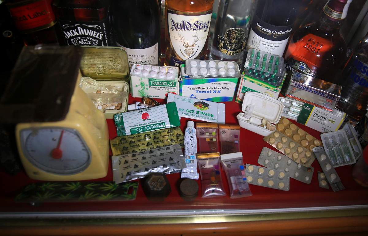 In this Monday, Feb. 11, 2019 photo, confiscated drugs and alcohol are stored inside the anti-drug department at the main police headquarters in Gaza City.