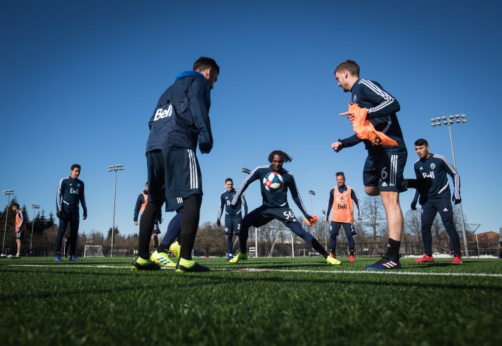 Vancouver Whitecaps midfielder Georges Mukumbilwa, centre, takes control of the ball while playing keep away before MLS soccer practice in Vancouver, on Tuesday February 26, 2019. The team is scheduled to open the 2019 season Saturday against Minnesota United. 