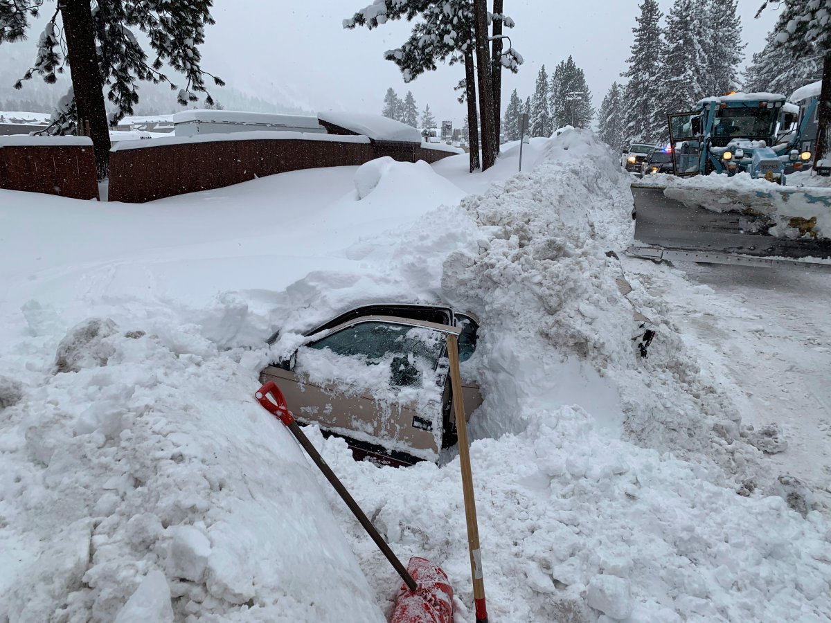 This Feb. 17, 2019 photo provided by City of South Lake Tahoe shows a car buried in snow in South Lake Tahoe, Calif.    