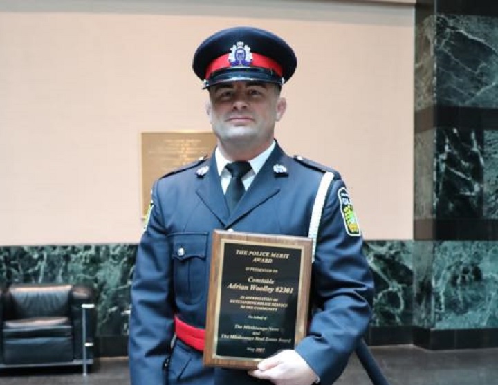 A Facebook photograph of Adrian Woolley receiving a police merit award on May 25, 2017.