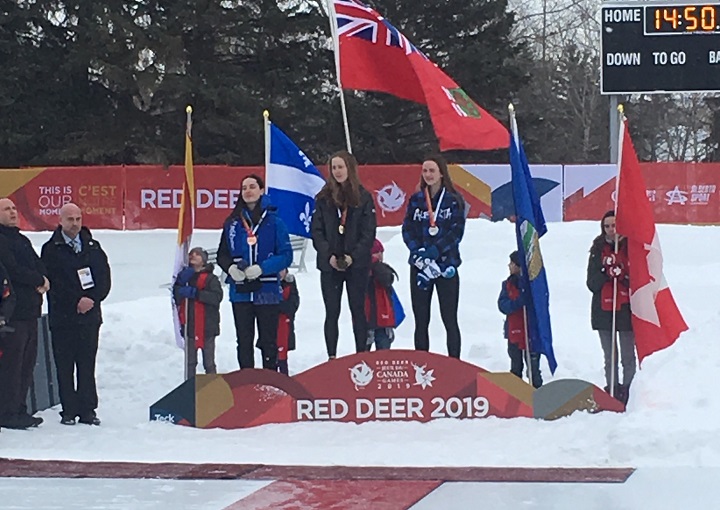 Clandeboye's Alexa Scott receives her gold medal at the Canada Winter Games after winning the Female - Long Track - 1000 metre race.
