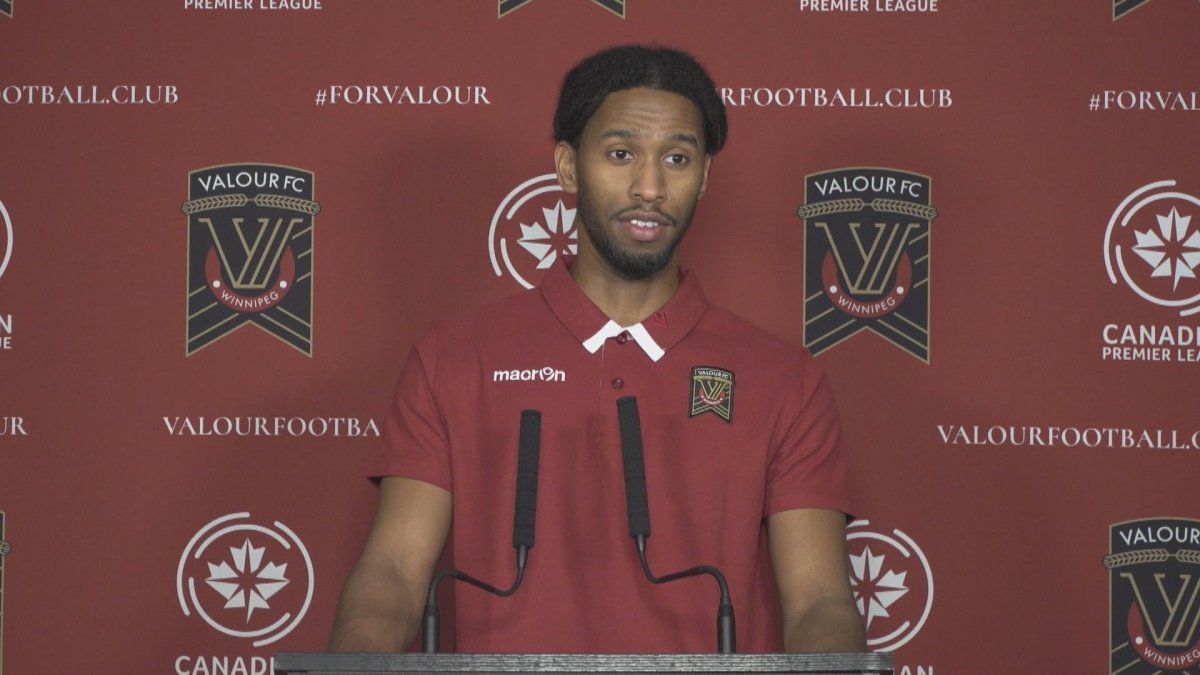 New Valour FC midfielder Ali Musse talks at his introductory media conference.