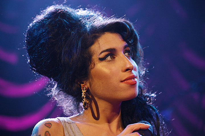Amy Winehouse performs onstage.