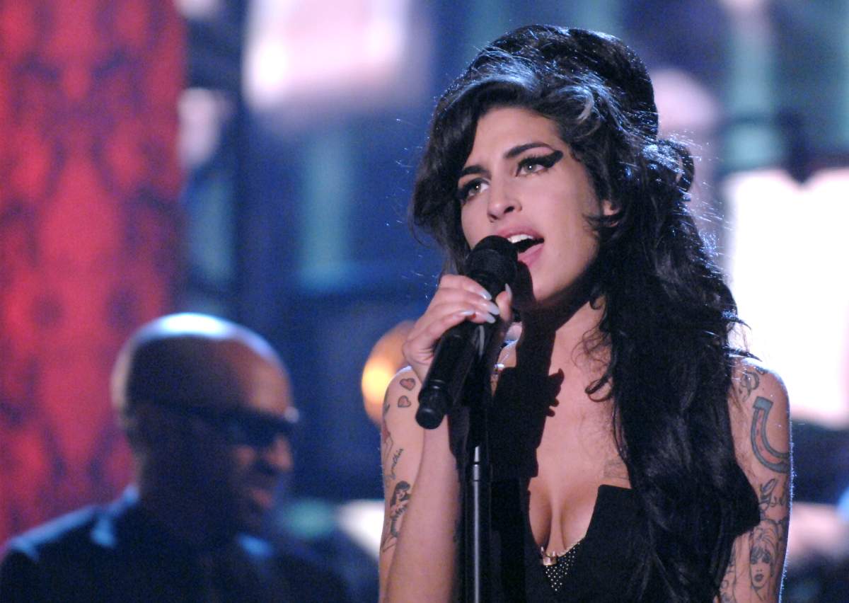 Amy Winehouse performs ‘Rehab’ during the MTV Movie Awards show at the Gibson Amphitheater in Los Angeles, Calif., in 2007.