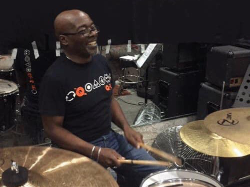 Andy Anderson perfoming live onstage.