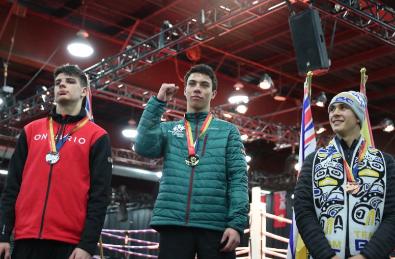 Boxer Isaiah Haya of Quispamsis, N.B., receives his gold medal at the 2019 Canada Games on Wednesday, Feb. 20, 2019. 