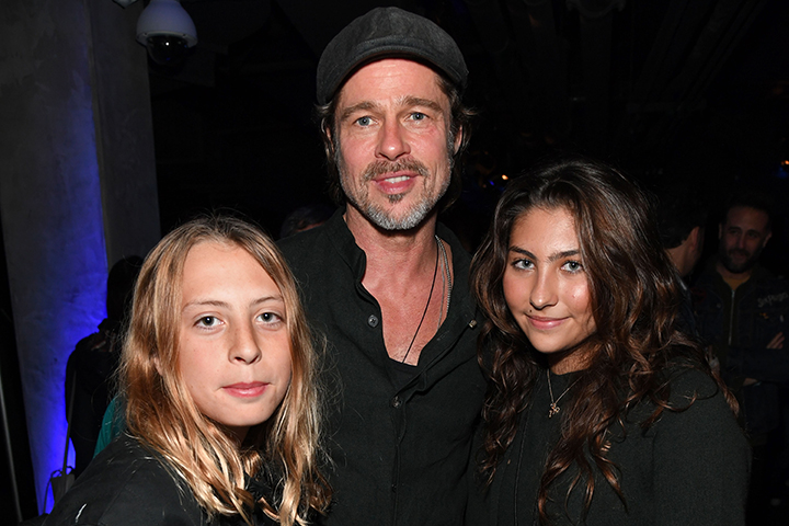 (L-R) Christopher Nicholas Cornell, Brad Pitt and Toni Cornell pose backstage during ‘I Am The Highway: A Tribute To Chris Cornell’ at The Forum on Jan. 16, 2019, in Inglewood, Calif.