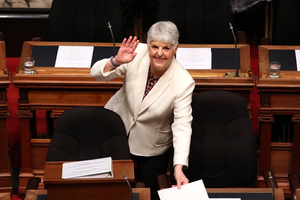Finance Minister Carole James arrives to deliver the budget speech as she waves to people in the gallery at the legislature in Victoria, B.C., on Tuesday, February 19, 2018. THE CANADIAN PRESS/Chad Hipolito.
