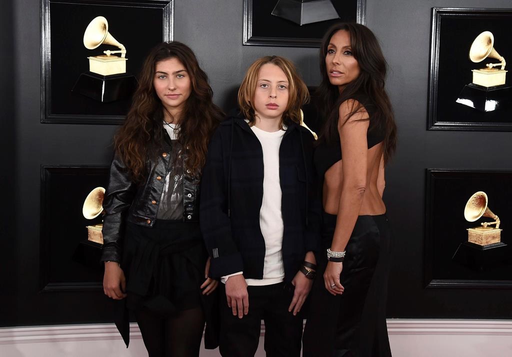 (L-R) Toni Cornell, Christopher Nicholas Cornell, and Vicky Karayiannis arrive at the 61st annual Grammy Awards at the Staples Center on Sunday, Feb. 10, 2019, in Los Angeles.