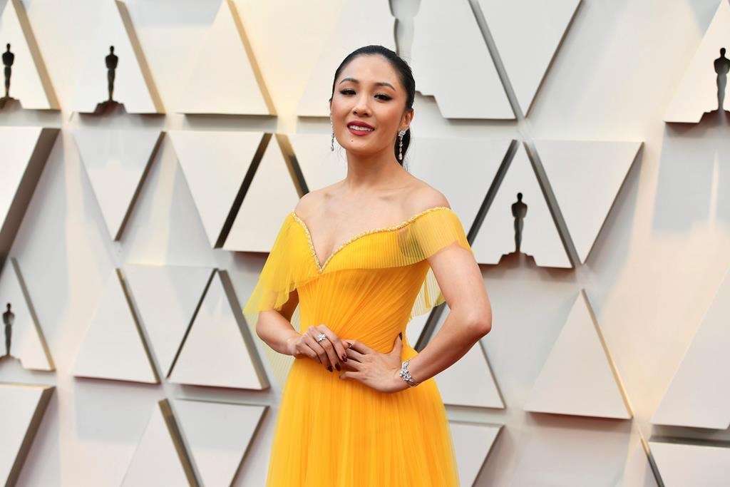 Constance Wu arrives at the Oscars on Sunday, Feb. 24, 2019, at the Dolby Theatre in Los Angeles.