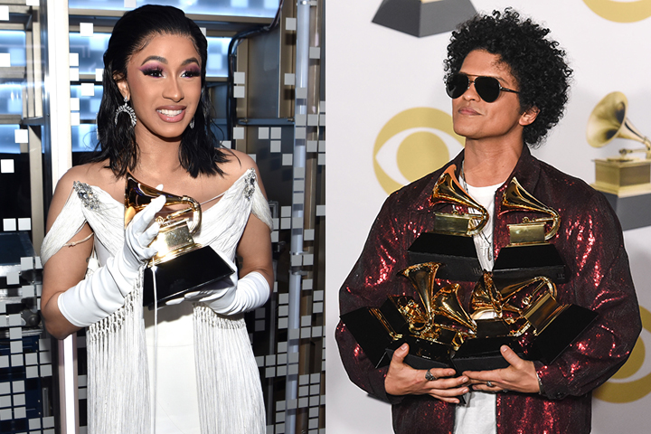 (L-R) Cardi B and Bruno Mars holding their golden Grammy statues.