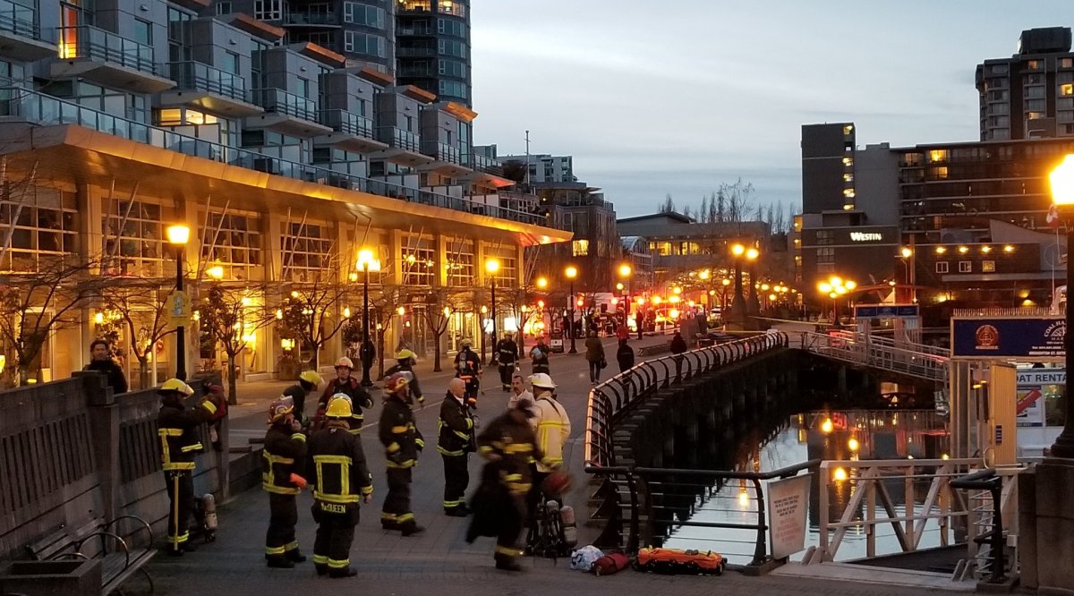 Firefighters and hazmat crews crowding Coal Harbour to respond to a fuel leak aboard a docked boat Thursday evening.