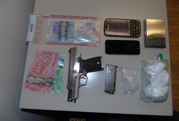 Cobourg and Port Hope police seized firearms and suspected cocaine and arrested two men on Tuesday.