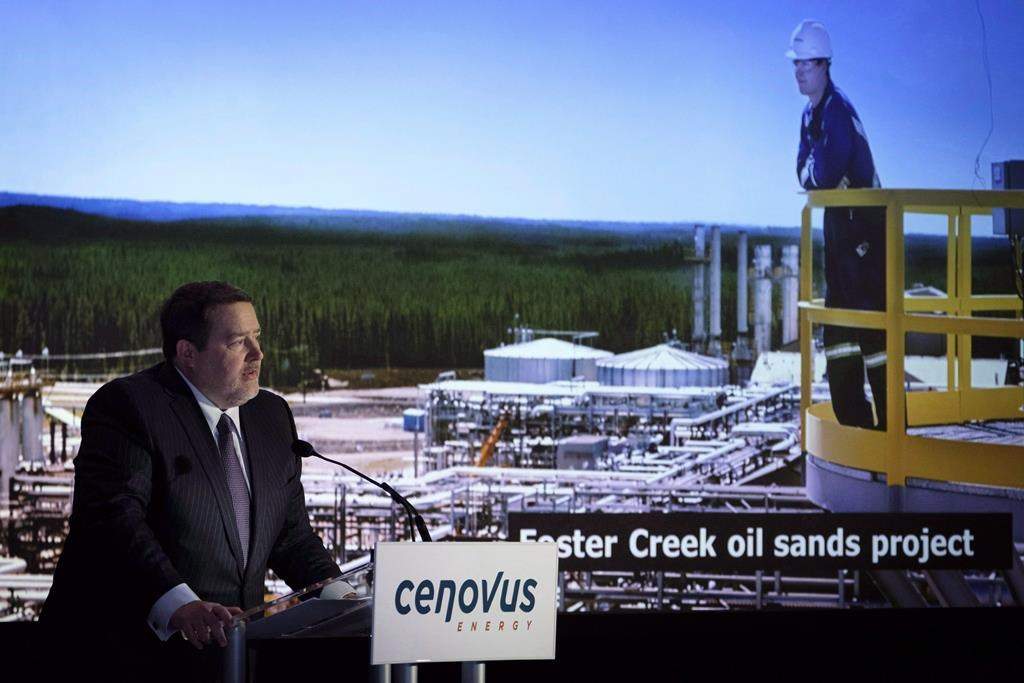 Cenovus president and CEO Alex Pourbaix, left, addresses the company's annual meeting in Calgary, Wednesday, April 25, 2018. 