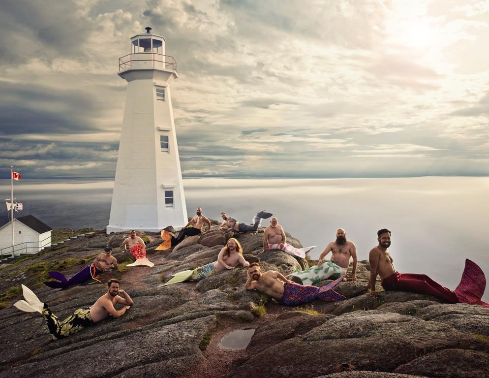 Men from the Newfoundland and Labrador Beard and Moustache Club pose as mermaids at Cape Spear Lighthouse National Historic site in this undated handout photo.