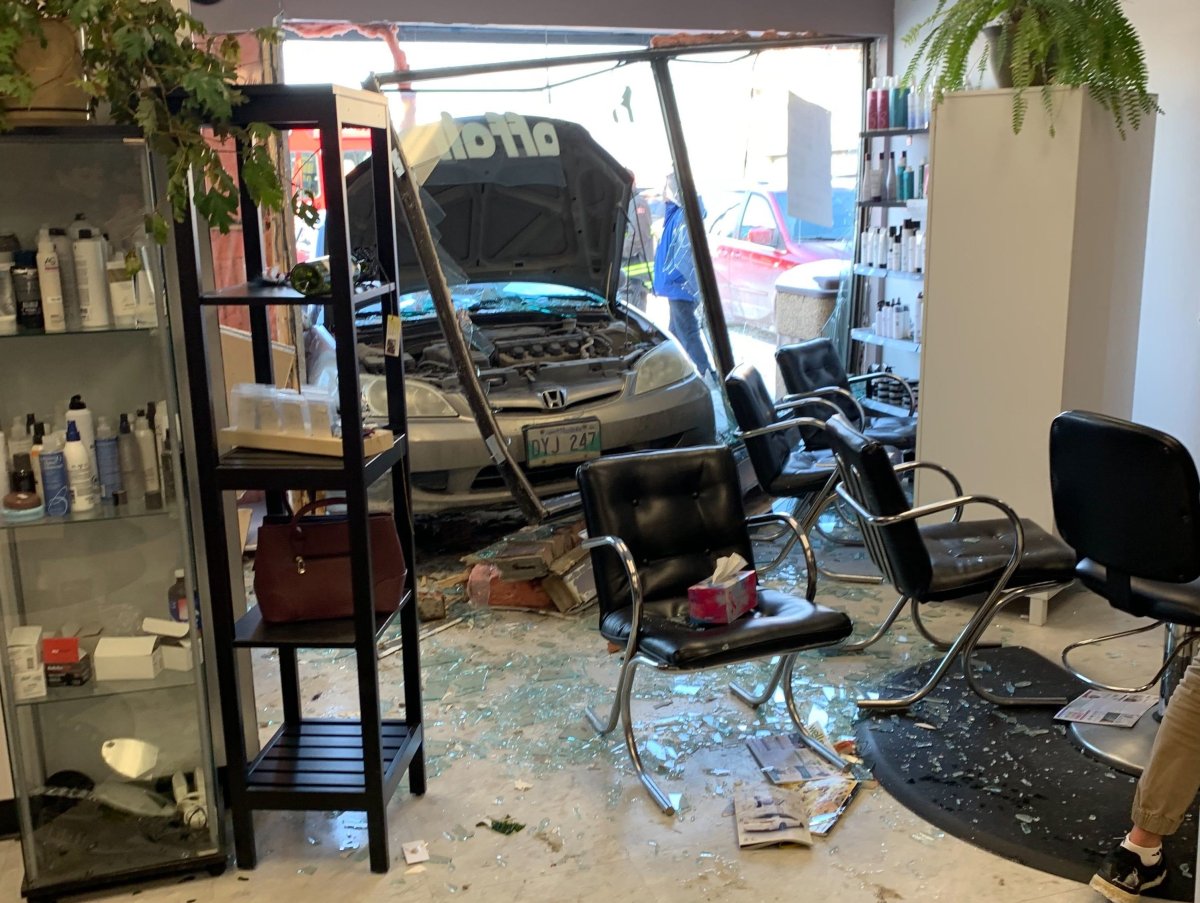 A car smashed into a hair salon Saturday. A boy was sitting in the chair now in the middle of the wreckage.