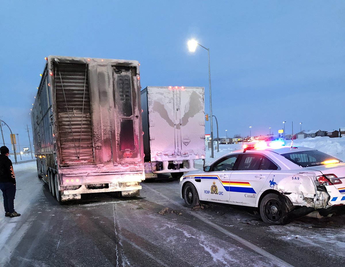 The RCMP cruiser was struck by a passing semi.