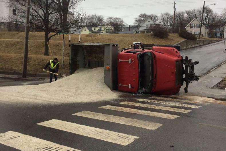 A salt truck tipped over in Trenton, N.S. Friday morning after slipping on a street. 