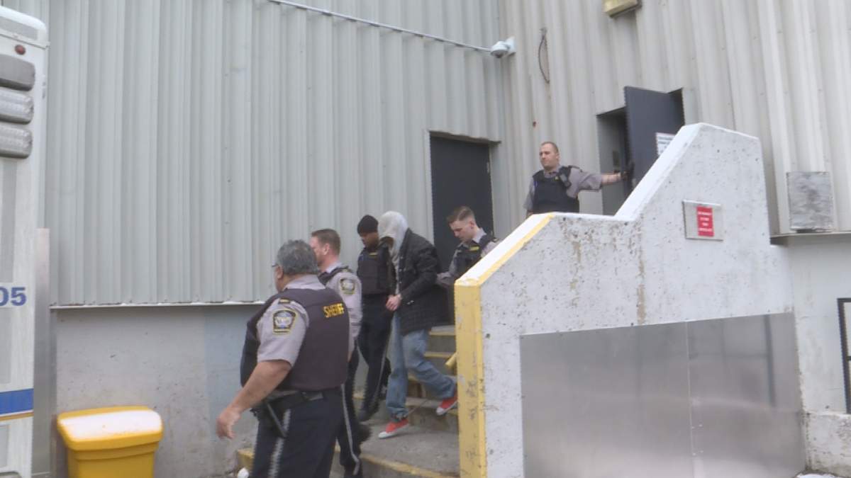 David Farrell, 38, of Windsor, N.S., is escorted by police out of Dartmouth Provincial Court on Thursday, Feb. 7, 2019.