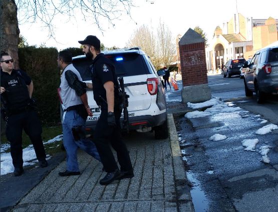 A man at the scene of Wednesday\’s stabbing outside Immaculate Conception Elementary School caught the moment the suspect was led away by officers.