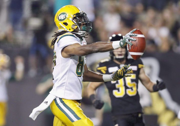 Edmonton Eskimos' Derel Walker scores a touchdown on the Hamilton Tiger-Cats during the first half of CFL football action in Hamilton, Ont. on August 23, 2018. 