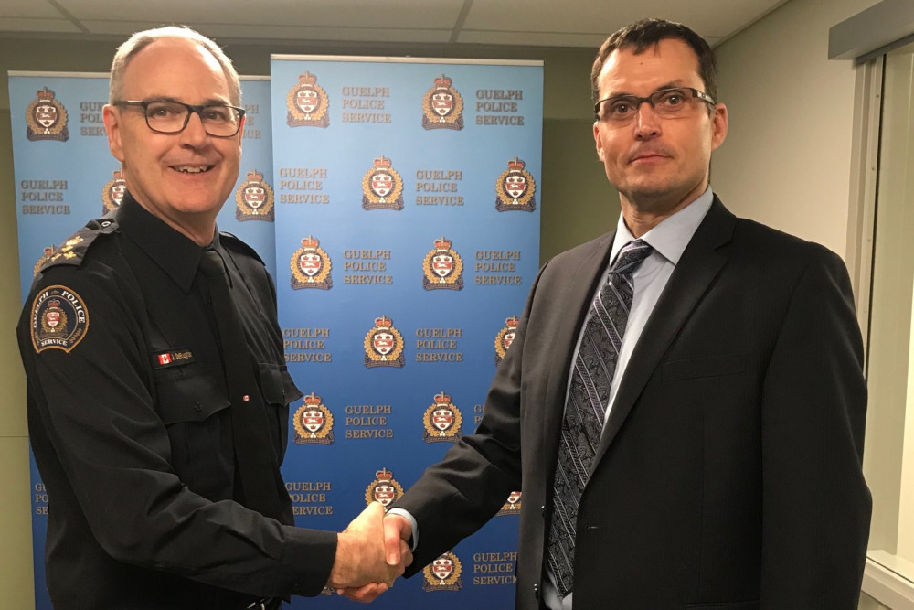 Guelph police Chief Jeff DeRuyter (left) with chief-designate Gordon Cobey.
